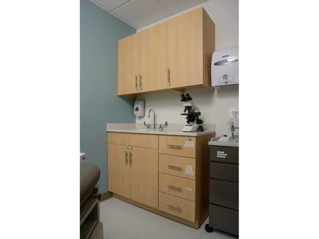 Pine Laminate Base Cabinets in exam room - Healthcare Casework