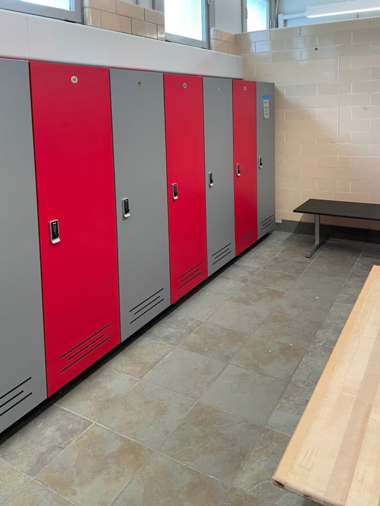 Red and grey laminate lockers with battery powered locks and full length lockers