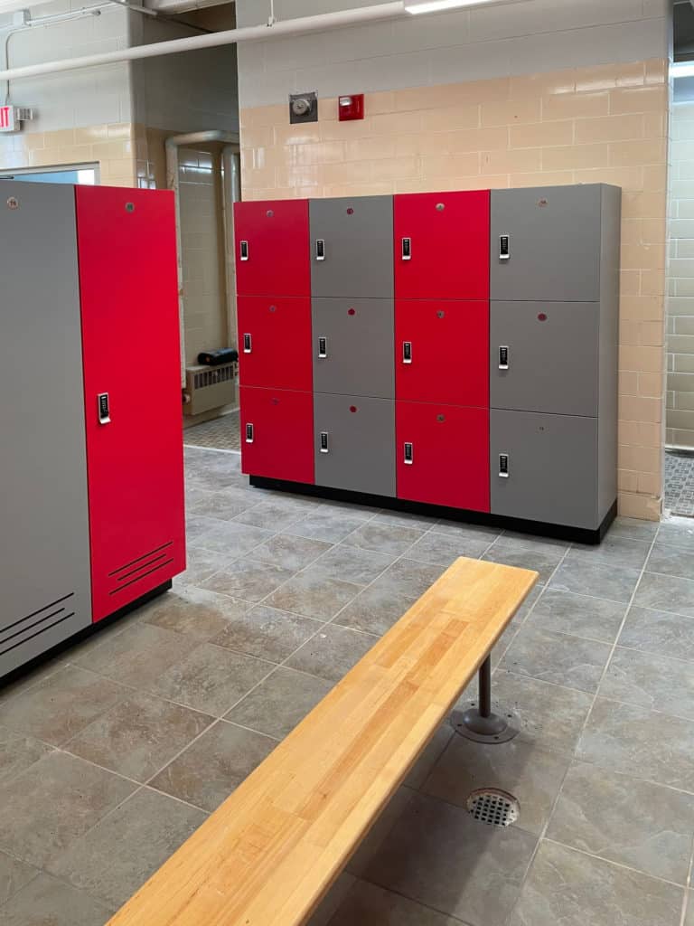 Red and grey laminate lockers with battery powered locks and vented full length lockers
