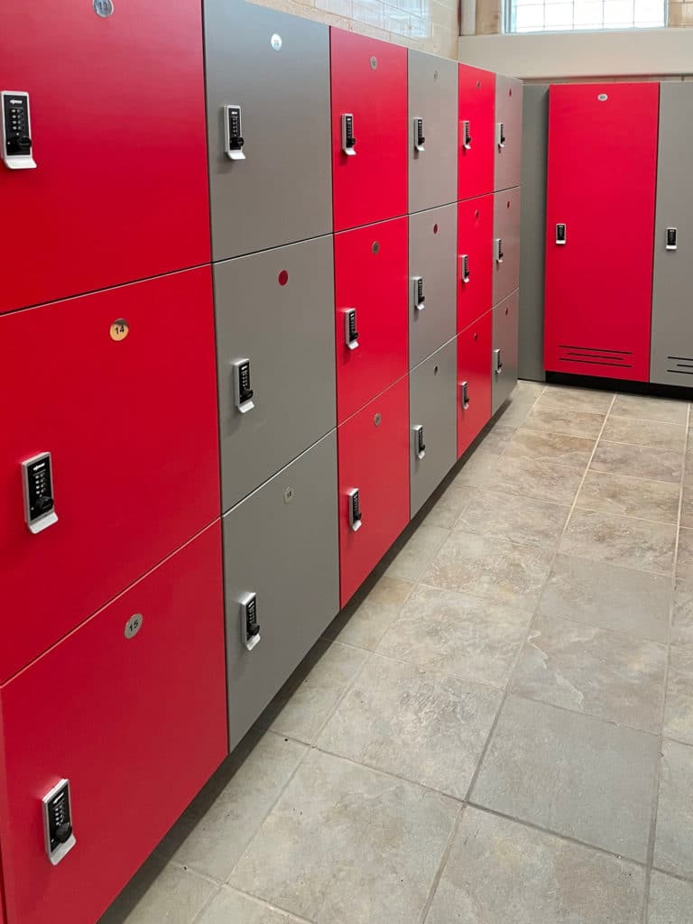 Red and grey laminate lockers with battery powered locks and full length lockers