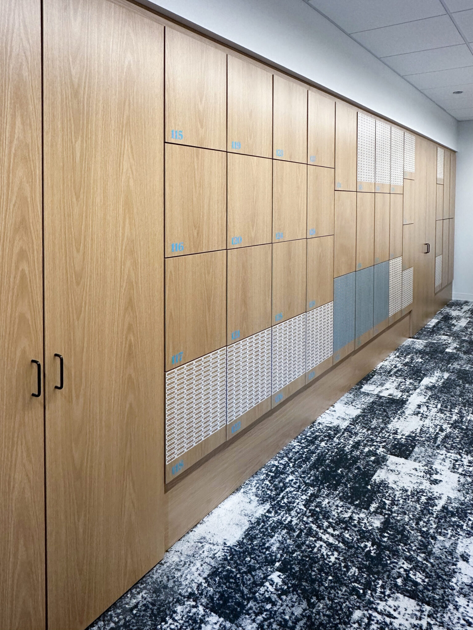 Premium multi-tier locker system with seating by HAMILTON